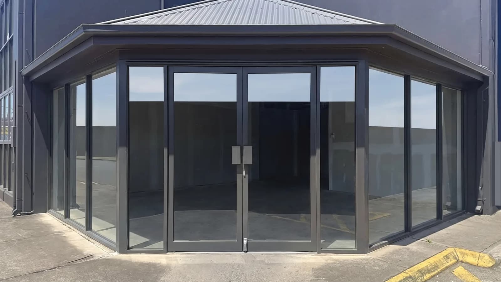 Plain shopfront with empty glass before signage